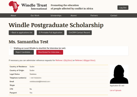 Screenshot of an example scholarship application. You can see the person's name, some tables of data and a placeholder photo. There's some buttons to help process the form.