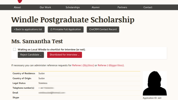 Screenshot of an example scholarship application. You can see the person's name, some tables of data and a placeholder photo. There's some buttons to help process the form.